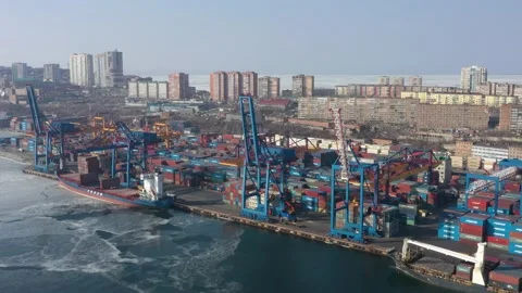 A top view of the seaport container terminal and city. Stock Footage 170412655