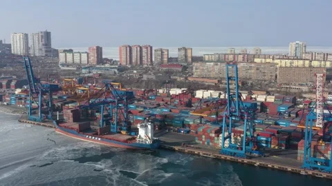 A top view of the seaport container terminal and city. Stock Footage 170758775