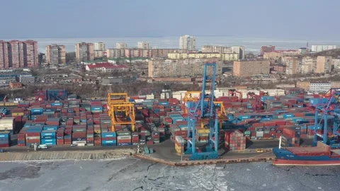 A top view of the seaport container terminal and city. Stock Footage 170997525