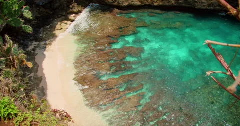 Top view secret beach cove turquoise water with tide pools and white sand Stock Footage 344754528