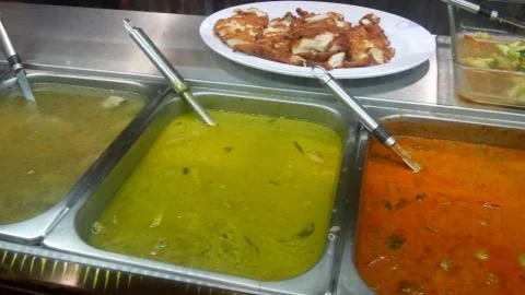 Top view of selection of various platters with delicious asian food and spice Stock Photos