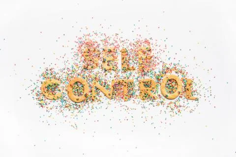 Top view of self control lettering made from sweets isolated on white, health Stock Photos