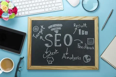 Top view of SEO Search Engine Optimization on black board and graph paper w.. Stock Photos