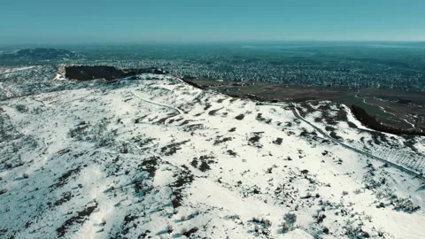 Top view of separation of snowy mountain and snowless city. Stock Footage 237162533