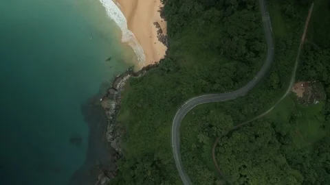 Top view, serpentine road near beach and rocks Stock Footage 226932553