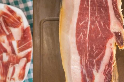 Top view of Serrano ham, plate in the background, closeup Foto stock
