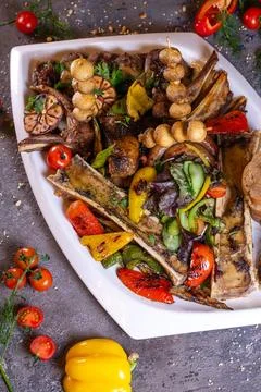 Top view of a set of different beef meat dishes on a white plate Stock Photos