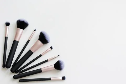 Top view of set of make up brushes and copy space over white Stock Photos