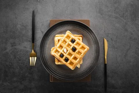 Top view set two waffles with gold cutlery. High quality and resolution Stock Photos