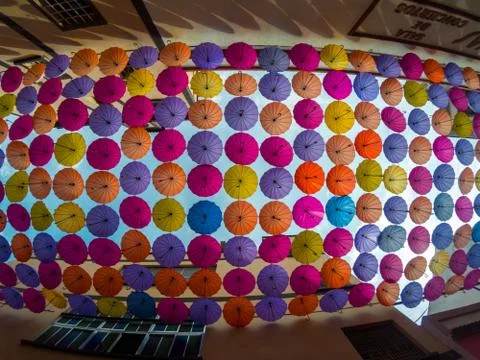 Top view of a set of umbrellas decorating a street a city Stock Photos