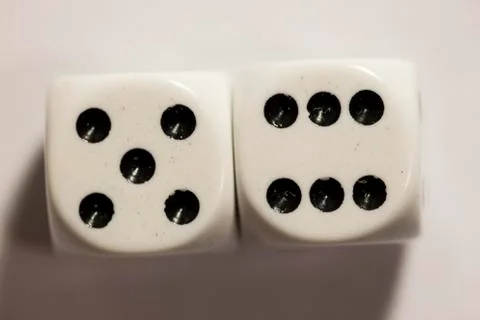 Top view of a set of white dice showing an eleven Photos