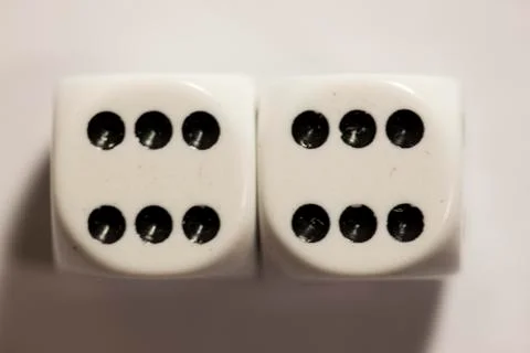 Top view of a set of white dice showing a twelve 스톡 사진