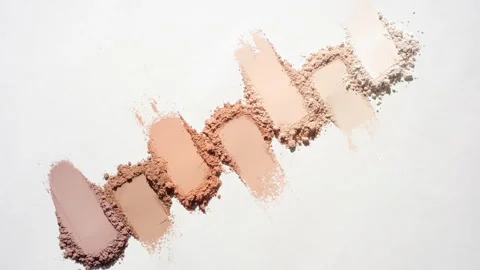 Top View of Seven Beige to Brown Powder Smudges with Shadows Stock Footage 335233476