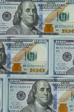 Top view of several one hundred 100 dollars banknotes bills greenbacks arrang Stock Photos