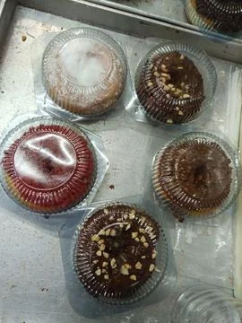Top view of several pumpkin doughnuts with various toppings Stock Photos