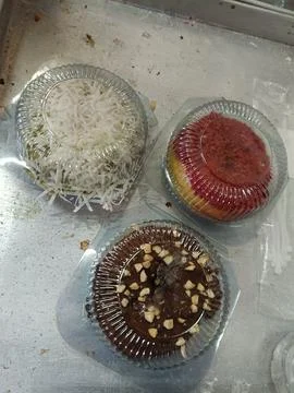 Top view of several pumpkin doughnuts with various toppings Stock Photos