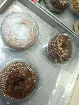 Top view of several pumpkin doughnuts with various toppings Stock Photos