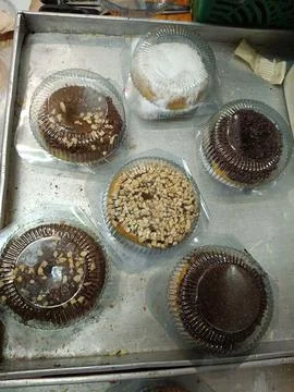 Top view of several pumpkin doughnuts with various toppings Stock Photos