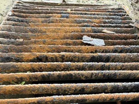 Top View of Severely Corroded Storm Drain Grate Stock Photos