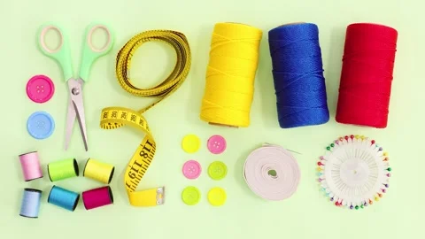 Top View of Sewing Accessories on Light Green Background 4K Stock Footage Stockbeeldmateriaal 341501668