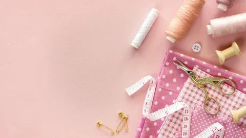 Top view sewing essentials with thread buttons Stock Photos