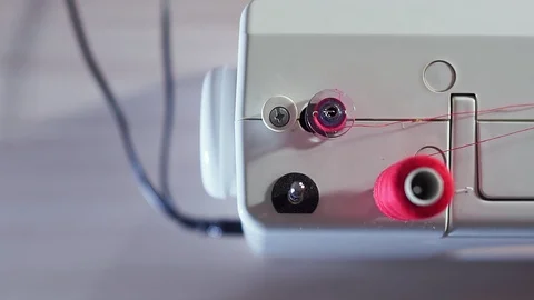 Top view of sewing machine. Rewinds reels to spools Stock Footage 101870074