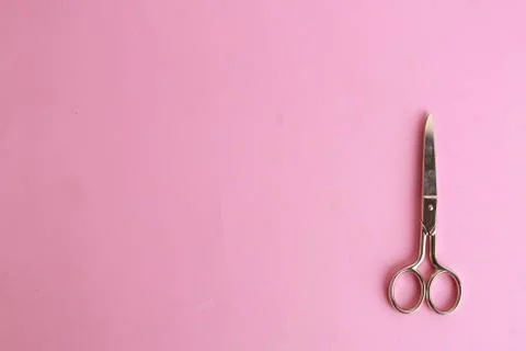 Top view of sewing scissors on a pink background Photos