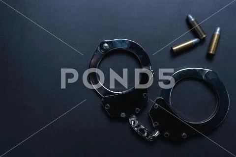 Top view, shackle and bullets on black background Stock Photos