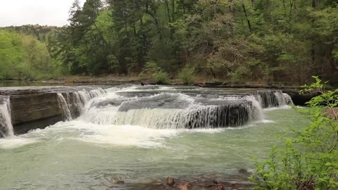 Top View Shallow Wide Waterfall flowing over Rock Ledge in Ozark Forest Stock Footage 340925523