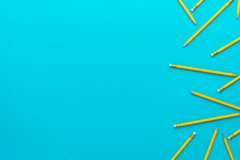 Top view of sharpened pencils over turquoise blue background with copy space Stock Photos
