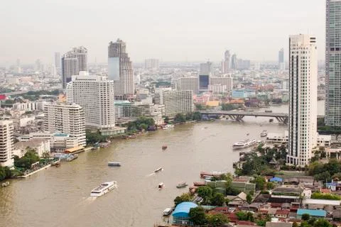 Top view ship on Chao Phraya river, bridge and city scape in Bangkok, Thailan Stock Photos