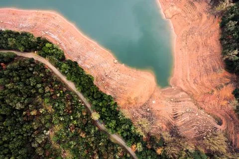 Top view of the shore of a half empty reservoir Stock Photos