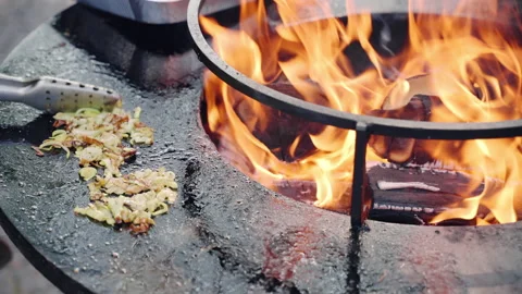 Top view shot of black round barbecue smoker with burning orange fire and Video stock 171949342