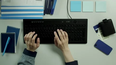 Top view shot. A guy covers his hand while entering his password Stock Footage 79967027