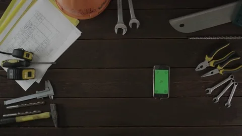 Top view shot. A guy doing his routine work and checking his cellphone Stock Footage 80005891