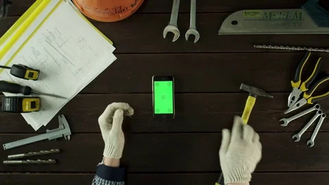 Top view shot. A guy learns how to use a hammer Stock Footage 80048571