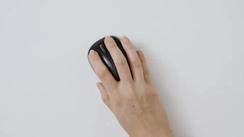 Top view shot. Hand using wireless computer mouse moving around and clicking Stock Footage 136938076