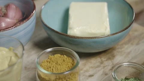 Top view shot of lined up ingredients for the legendary café-de-paris Stock Footage 256057083