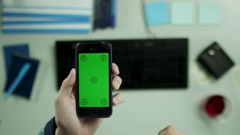 Top view shot. A man calmly scrolling pictures on his cellphone Stock Footage 79993193