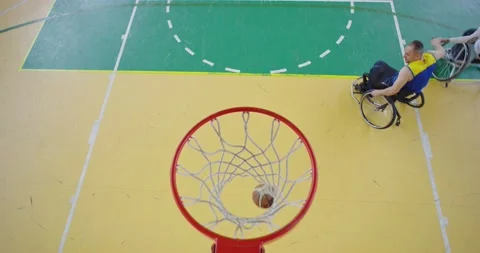 Top view shot of Persons with disabilities playing basketball in the modern hall 스톡 동영상 167035208