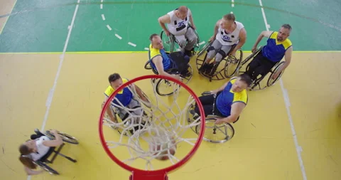 Top view shot of Persons with disabilities playing basketball in the modern hall 스톡 동영상 172160277