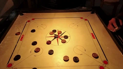 A top-view shot of players playing carrom 스톡 동영상 247084174