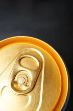 Top view shot of a  pull tab on a tin can in black background Foto stock