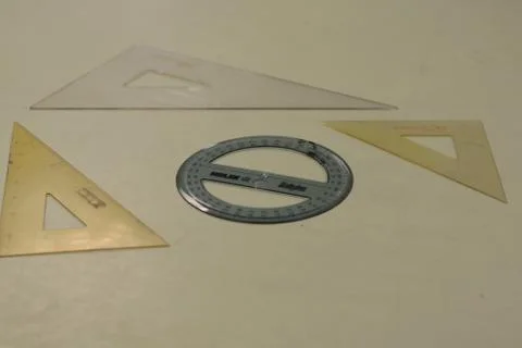 Top view shot of triangular nd round rulers on the table Fotos de archivo