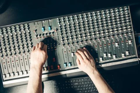 Top view shot.man regulating the volume Stock Photos