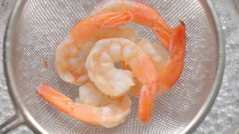 Top view of shrimp in Mesh Colander Strainer Basket Food into boiling water. Stock Footage 272284624