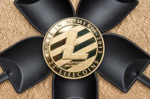 Top view silver litecoin crypto over black shovel mining on golden rough grou Stock Photos