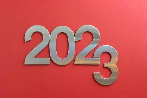Top view silver numerals with the new year on a red monochrome background Stock Photos