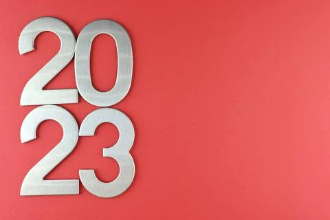 Top view silver numerals with the new year on a red monochrome background Stock Photos