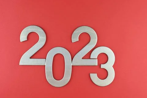 Top view silver numerals with the new year on a red monochrome background Stock Photos